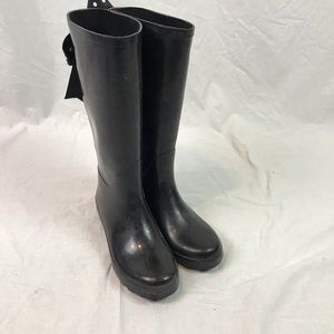 Black rain boots with polka dot bow